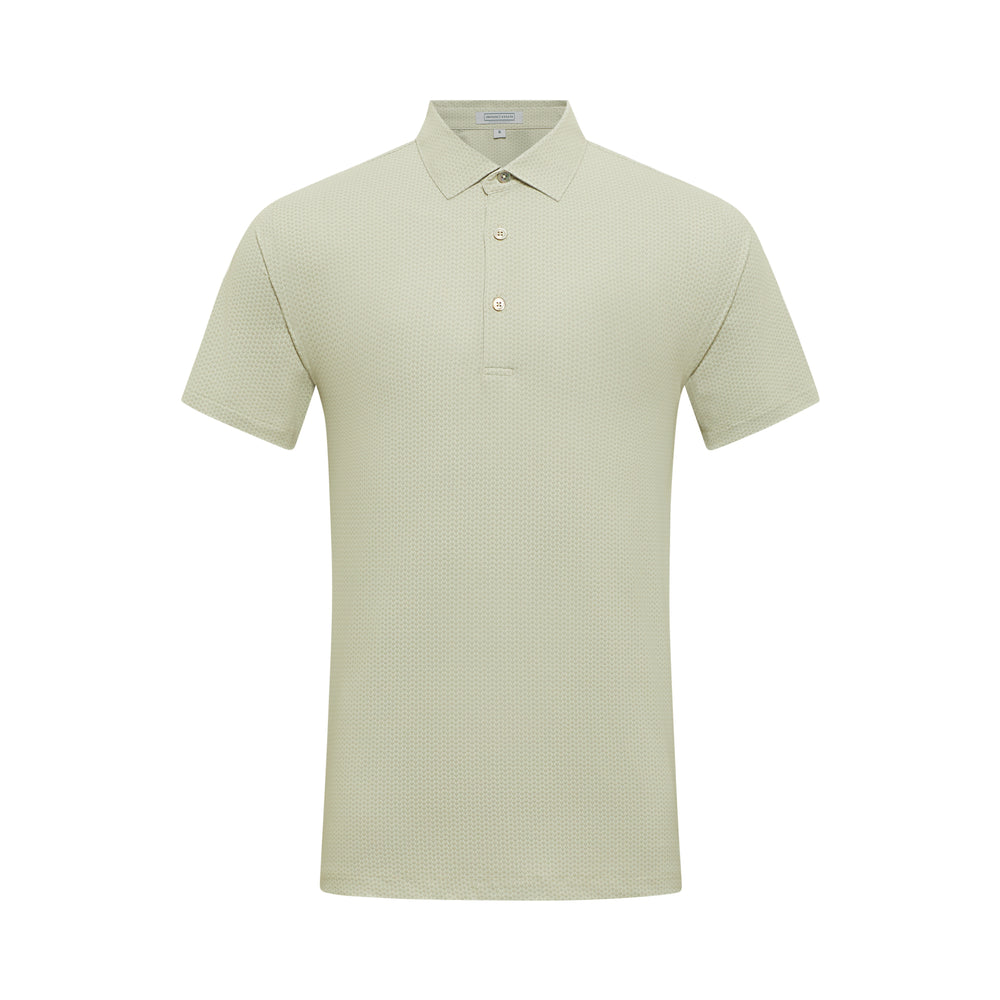 Male model wearing a light grey Hove Performance Polo and black golf shorts by Fenix XCell, standing confidently poolside in a tropical resort setting, styled for an upscale golf lifestyle
